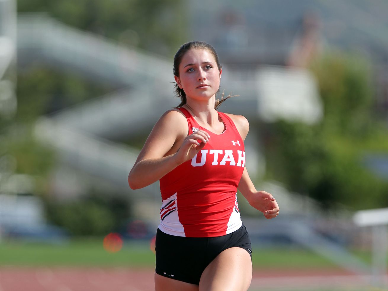 Utah’s Lauren McCluskey, runs on Aug. 30, 2017, in Salt
Lake City. McCluskey, 21, was shot and killed on campus on Oct. 22,
2018. The Utah House approved a $13.5 million settlement between
her parents and the university on Friday.