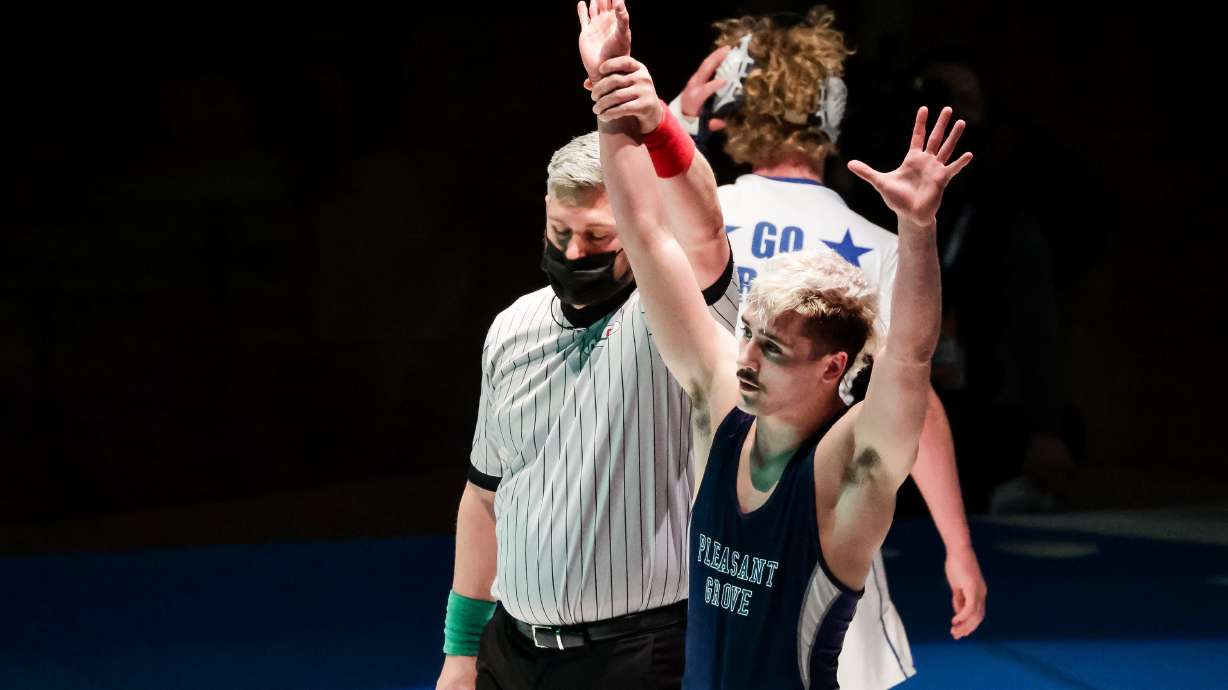 Pleasant Grove’s Alex Emmer celebrates after defeating Koda DeAtley, also of Pleasant Grove, in the 138-pound finals match at the 6A wrestling state championship at Corner Canyon High School in Draper on Friday, Feb. 19, 2021.