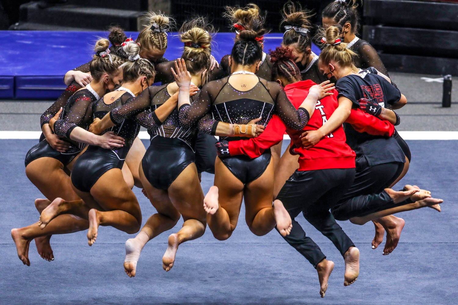Utah's gymnasts huddle as Utah and UCLA compete in a gymnastics meet at the Huntsman Center in Salt Lake City on Friday, Feb. 19, 2021.