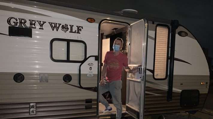 Megan's husband, Derek, quarantined in the family trailer after testing positive.