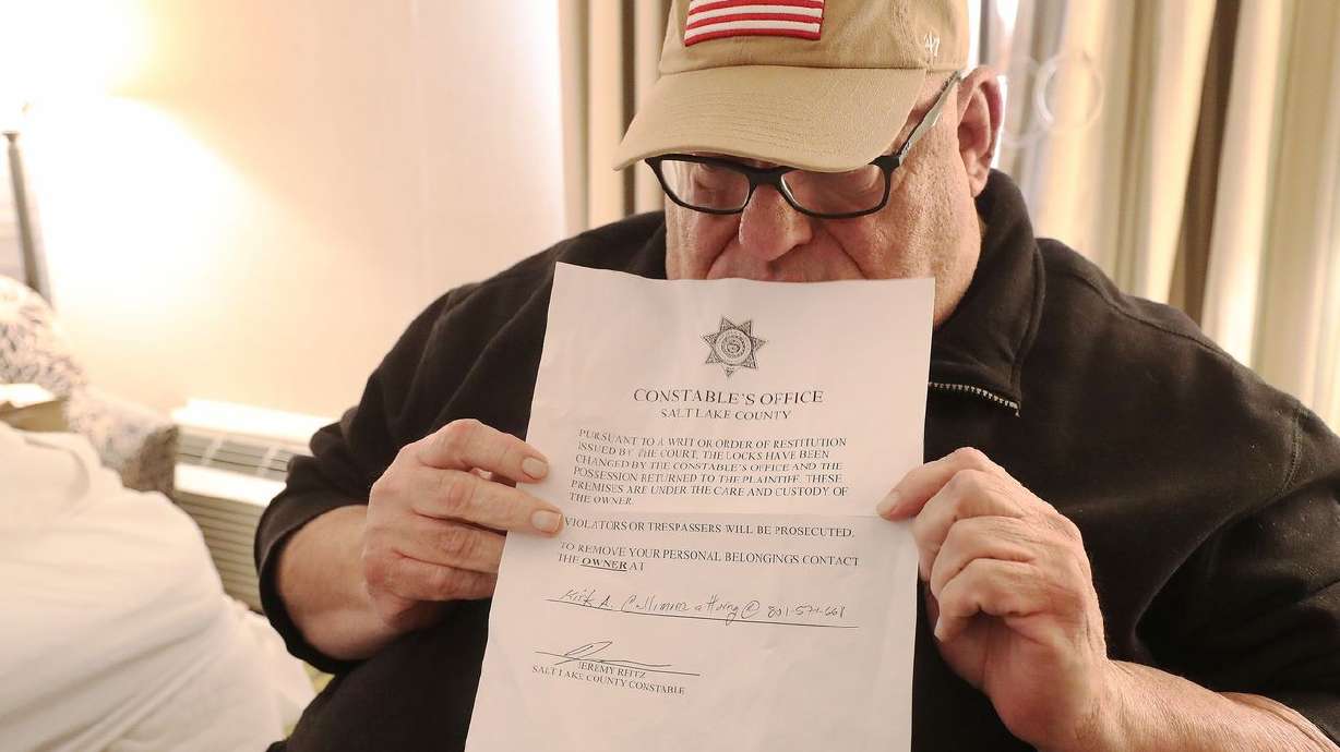 Doug Henderson holds an eviction notice in Salt Lake City on Jan. 15, 2021. The freeze on evictions in place since September 2020 expired at the end of July.