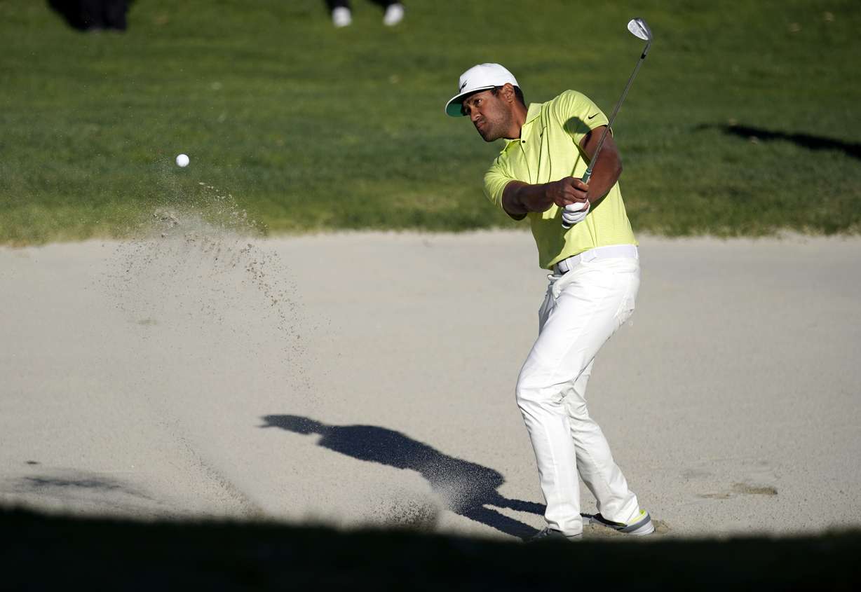 Tony Finau hits his second shot out of the bunker on the 14th hole during a playoff against Max Homa in the final round of the Genesis Invitational golf tournament at Riviera Country Club, Sunday, Feb. 21, 2021, in the Pacific Palisades area of Los Angeles.