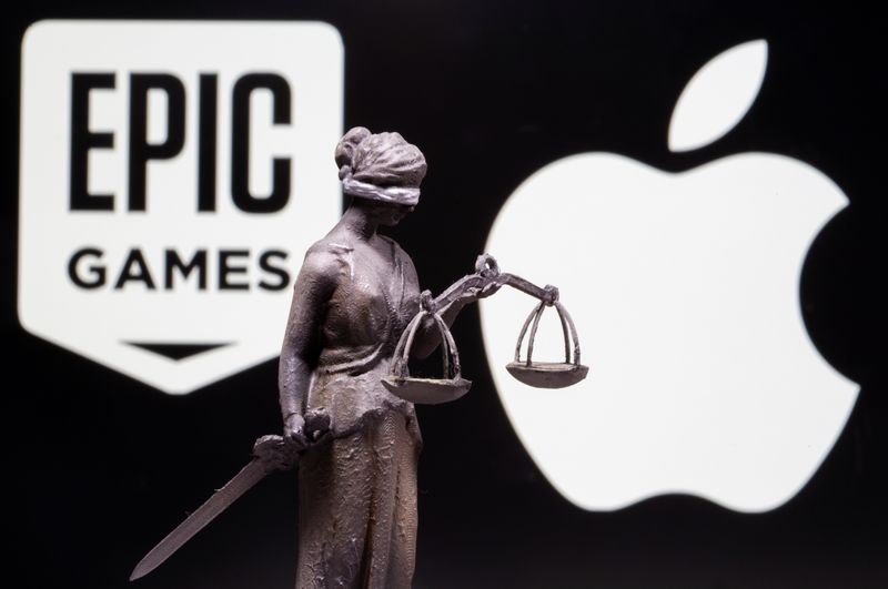 FILE PHOTO: 3D printed Lady Justice figure is seen in front of displayed Apple and Epic Games logos in this illustration photo taken February 17, 2021. REUTERS/Dado Ruvic/Illustration