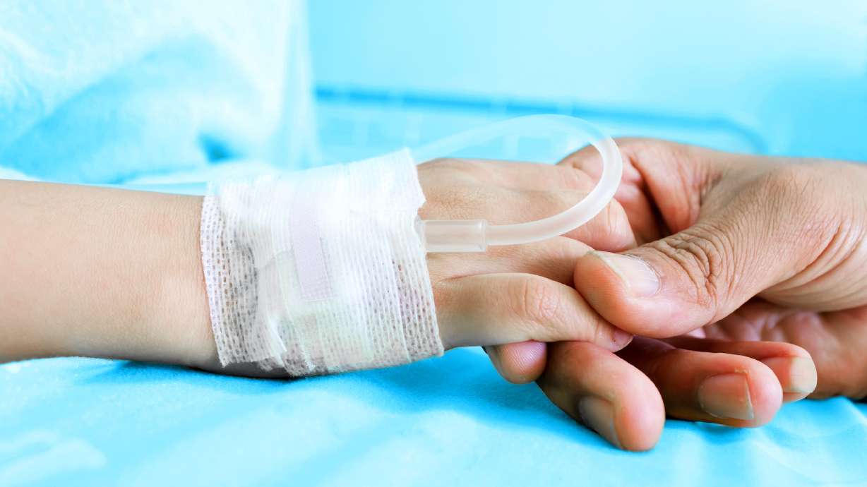 IV solution in a child's patients hand