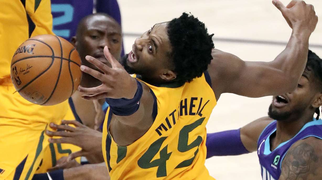 Utah Jazz guard Donovan Mitchell (45) reaches for the rebound during an NBA game against the Charlotte Hornets at the Vivint Smart Home Arena in Salt Lake City on Monday, Feb. 22, 2021.