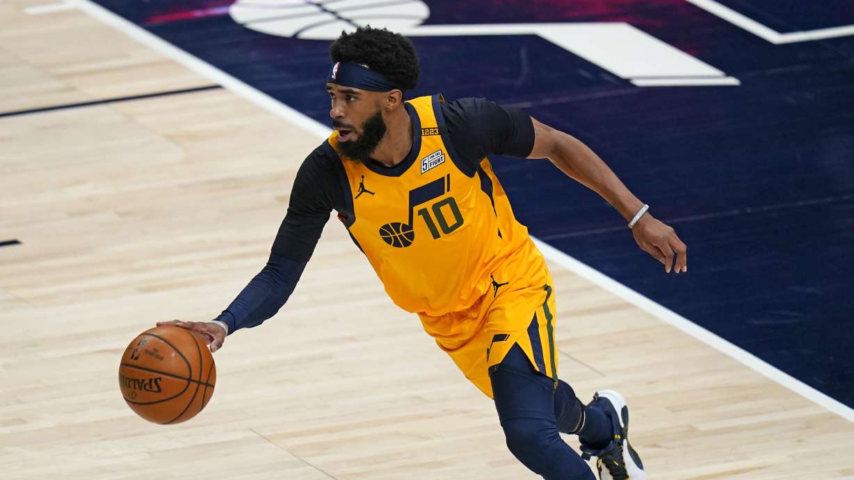 Utah Jazz guard Mike Conley (10) brings the ball up court in the first half during an NBA basketball game against the Charlotte Hornets Monday, Feb. 22, 2021, in Salt Lake City. (AP Photo/Rick Bowmer)