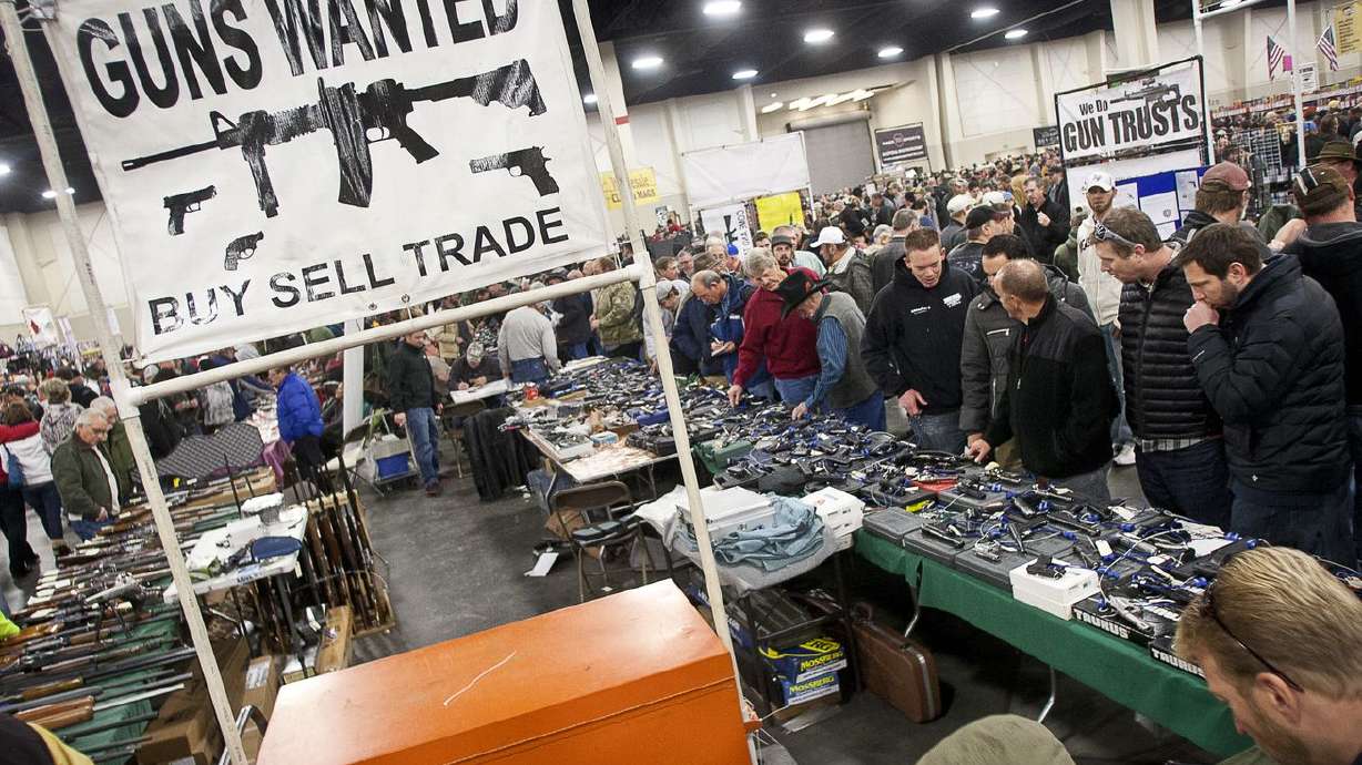 Crowds gather around used weapons dealers at the South
Towne Expo Center during the 2013 Rocky Mountain Gun Show on
Saturday, Jan. 5, 2013.