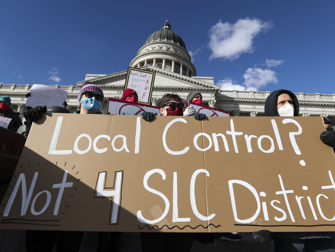 Salt Lake City School District teachers hold signs as
they attend a press conference in support of student and educator
safety during the COVID-19 pandemic on the steps of the Capitol in
Salt Lake City on Wednesday, Feb. 24, 2021. The Salt Lake Education
Association held the event to raise awareness of the actions of
lawmakers who worked to leverage the Salt Lake City School District
with legislation designed to usurp local elected school board
authority and punish the school district for choosing remote
instruction until teachers were vaccinated or safety metrics were
met.