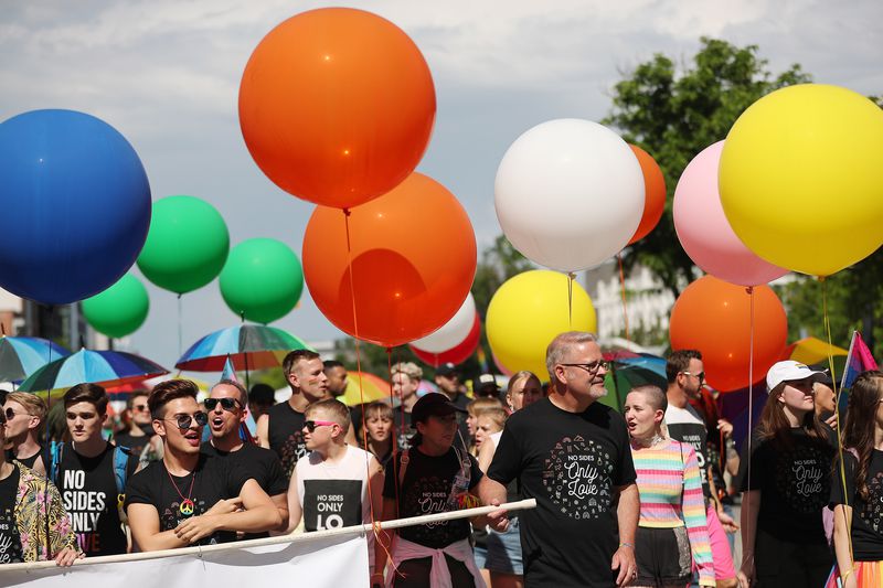 People affiliated with Encircle, a LGBTQ family and
youth resource center, march during the 44th annual Utah Pride
Parade in Salt Lake City on Sunday, June 2, 2019.
