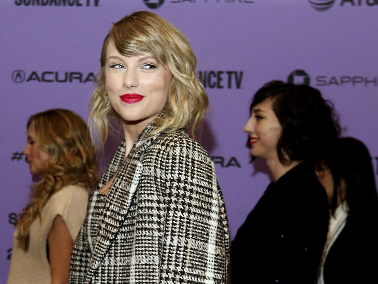 Taylor Swift poses for photos before the premiere of
the documentary "Miss Americana” at the Eccles Theatre in Park City
on Thursday, Jan. 23, 2020.