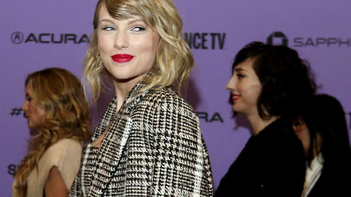 Taylor Swift poses for photos before the premiere of
the documentary "Miss Americana” at the Eccles Theatre in Park City
on Thursday, Jan. 23, 2020.
