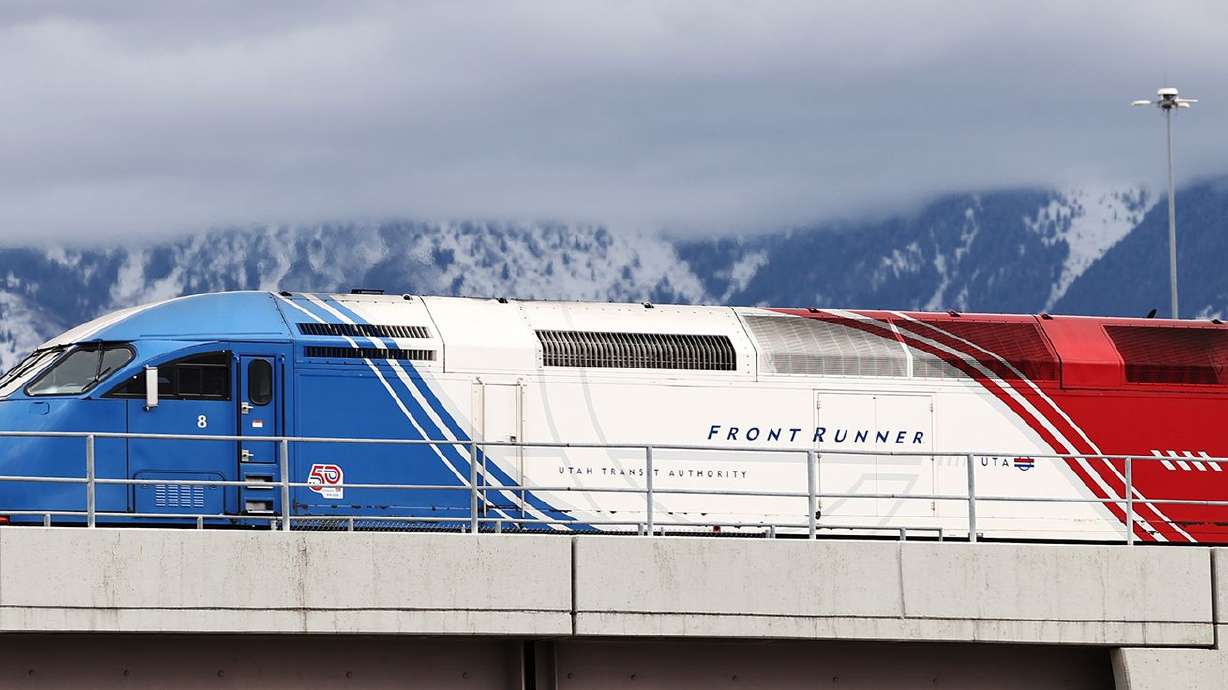 A southbound FrontRunner train crosses 9000 South in
Sandy on Friday, Feb. 12, 2021. Double-tracking FrontRunner is one
of the infrastructure projects being considered in the
Legislature’s budget talks.