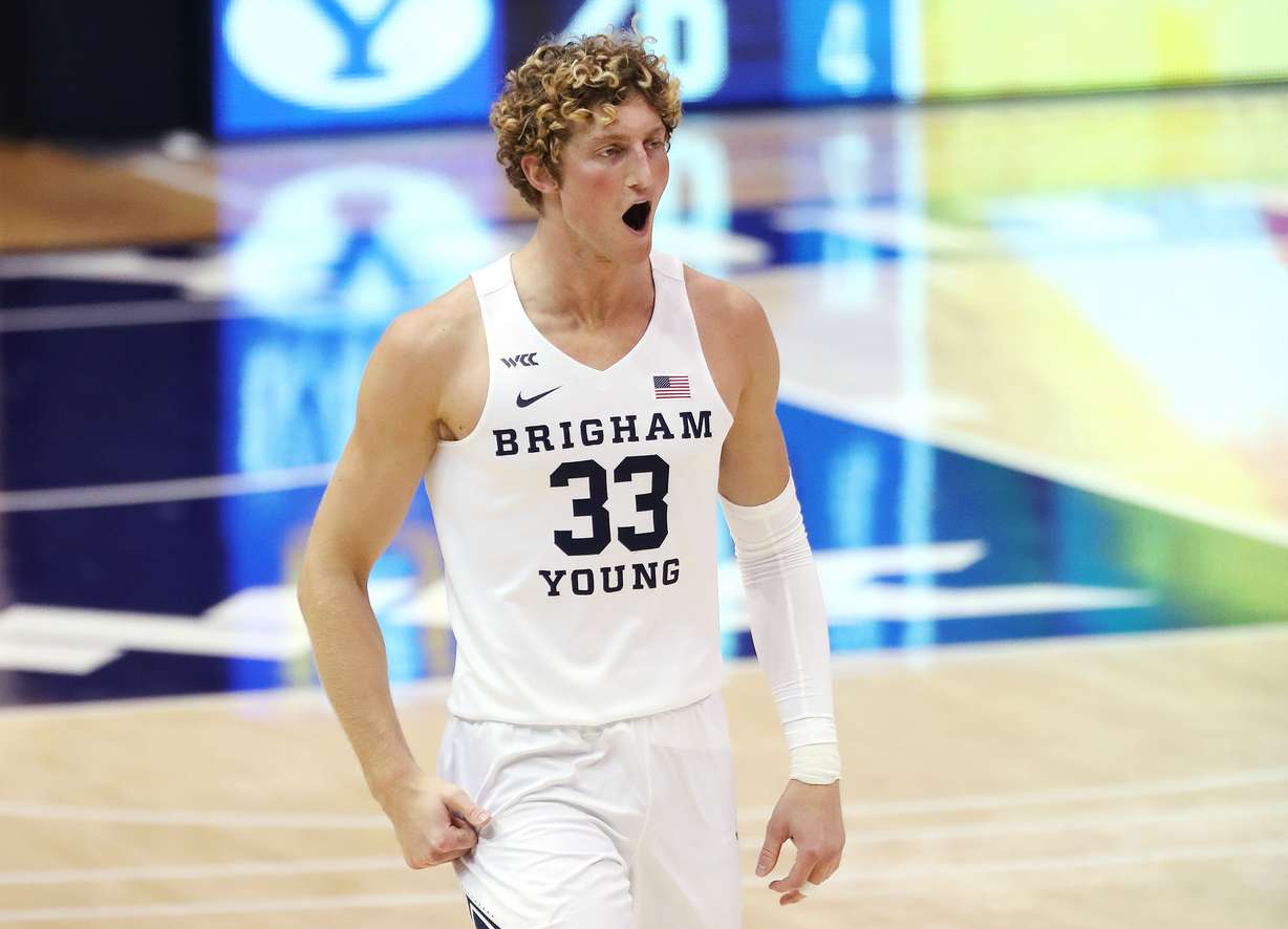 BYU forward Caleb Lohner (33) celebrates a 3-pointer against the San Francisco Dons in Provo on Thursday, Feb. 25, 2021.