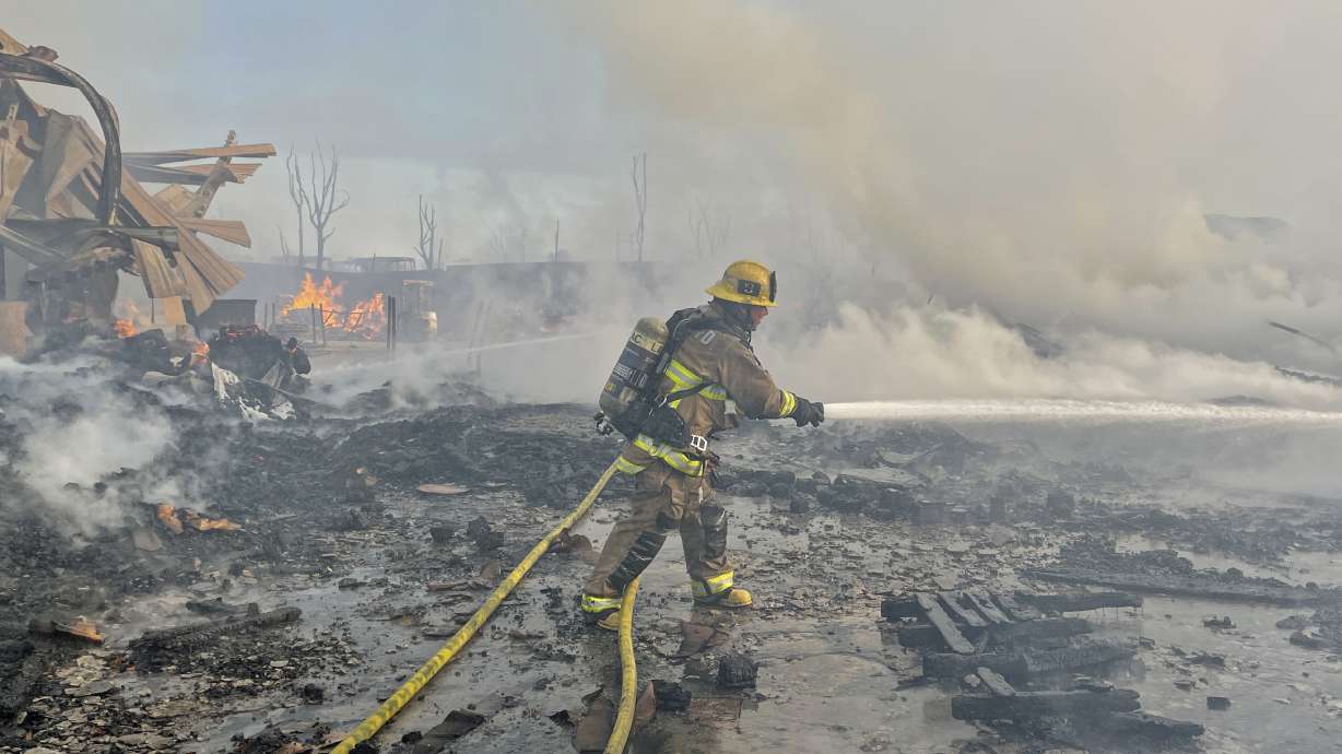Fire visible across Los Angeles burns commercial yard, buses
