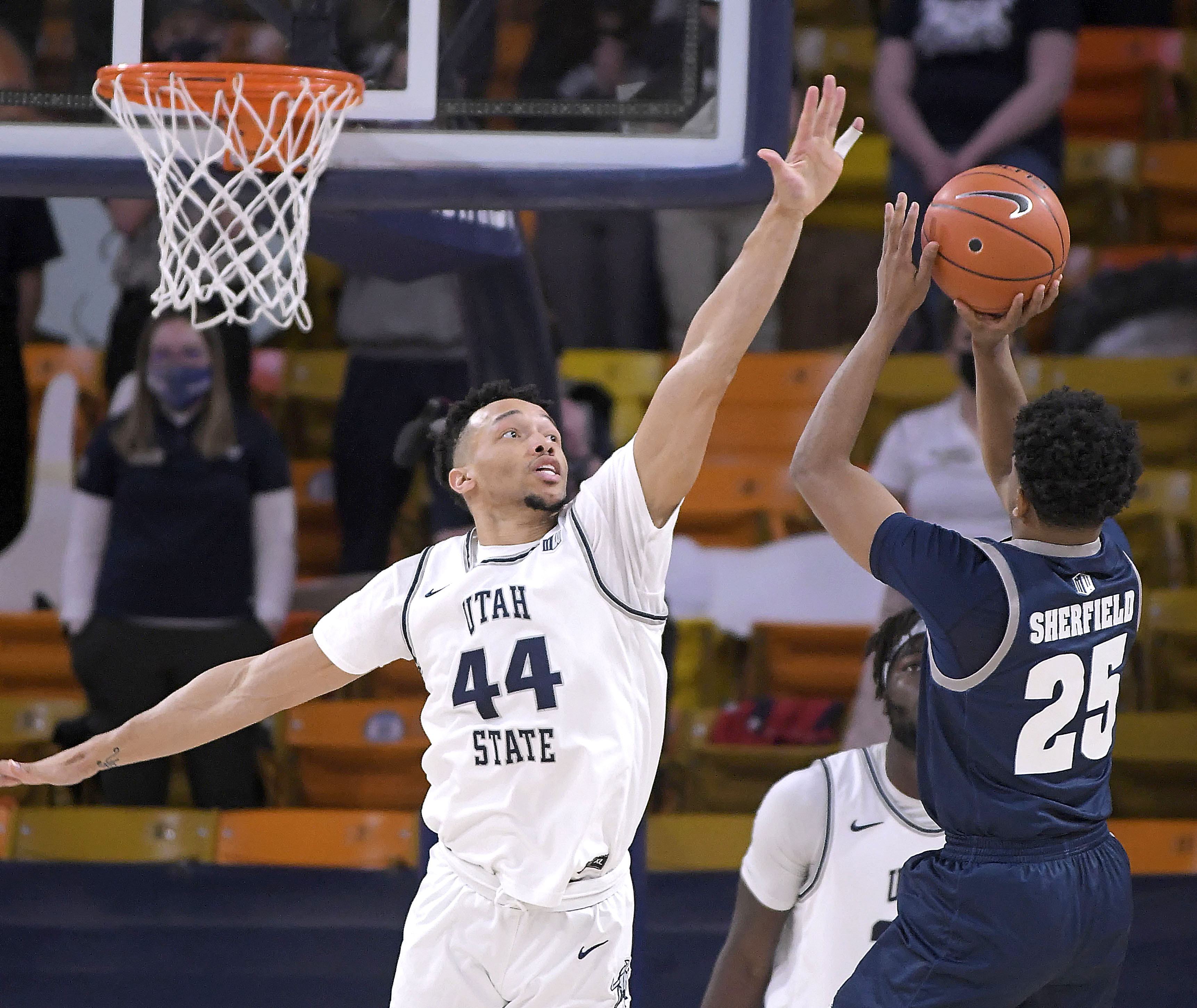 Marco Anthony defends a shot against Nevada, Friday, Feb. 26, 2021 in Logan.