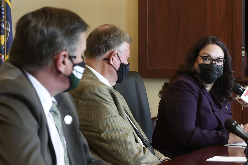 Rep. Val Peterson, R-Orem, left, Senate Majority Leader Evan Vickers, R-Cedar City, and Senate Minority Whip Luz Escamilla, D-Salt Lake City, discuss SB195 in the Senate Rules Room at the Capitol in Salt Lake City on Wednesday, Feb. 17, 2021. The bill,
sponsored by Vickers, stems from the power struggle that persisted between former Gov. Gary Herbert and the Legislature throughout the COVID-19 pandemic. Among other things, it would limit the duration of a public health order to 30 days.