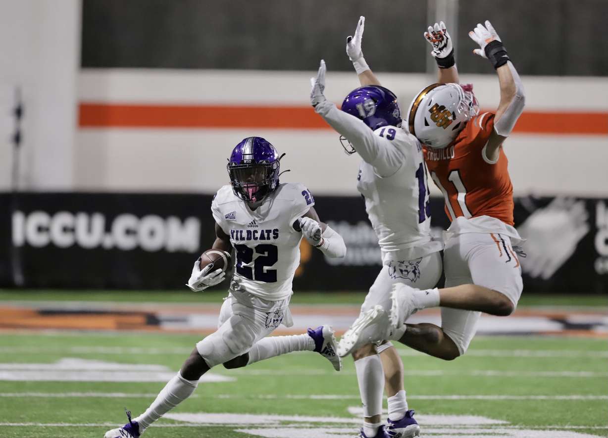 Weber State's Rashid Shaheed runs for a score during the Wildcats' FCS spring opener at Idaho State, Saturday, Feb. 26, 2021.