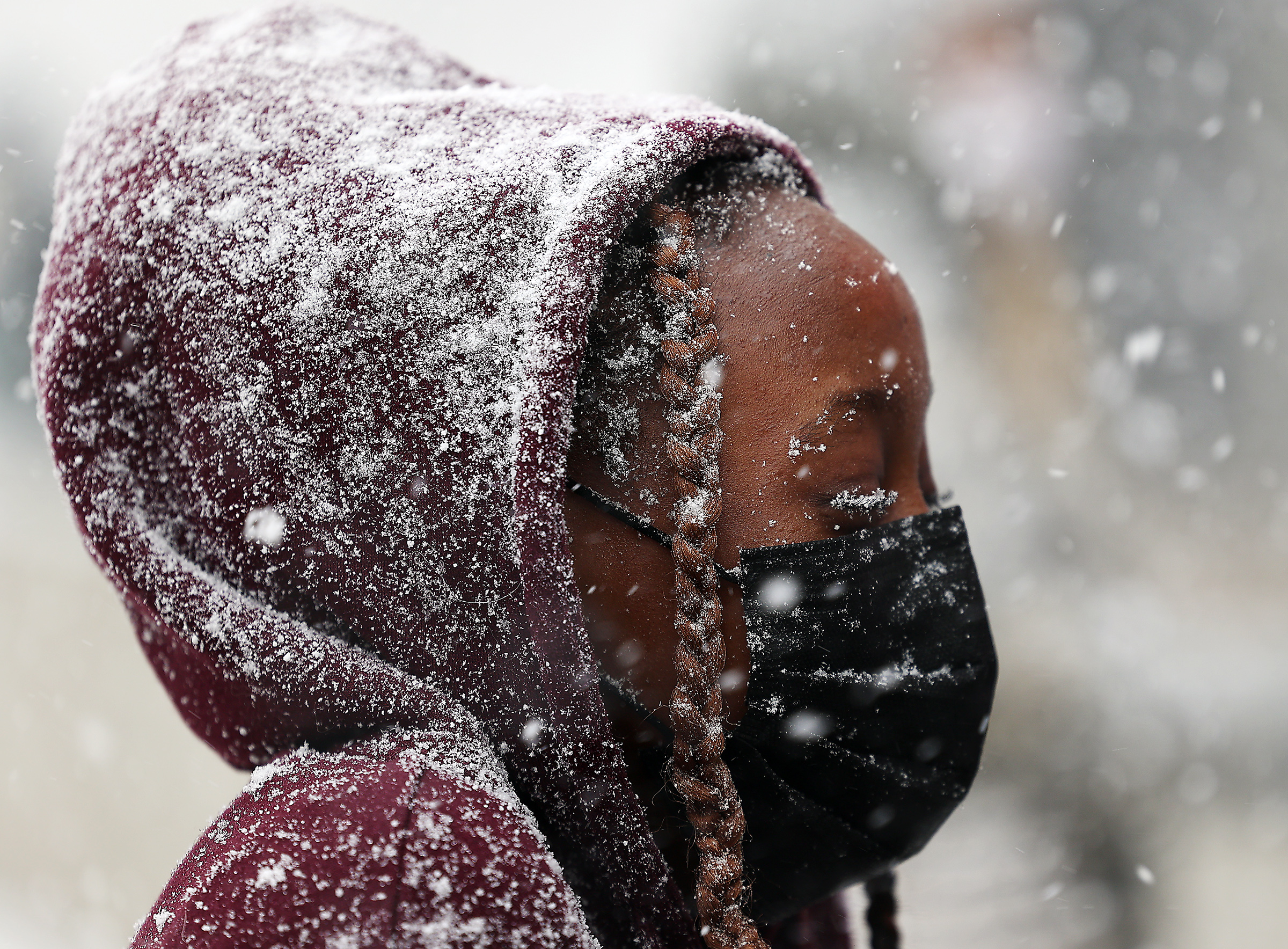 Amina Schlichter stands in the snow as she attends a press conference by the Utah chapter of Black Lives Matter followed by a ribbon-cutting ceremony for the opening of the Utah Black History Museum, the state's first museum dedicated to local and national African American history at the Leonardo in Salt Lake City on Saturday, Feb. 27, 2021.