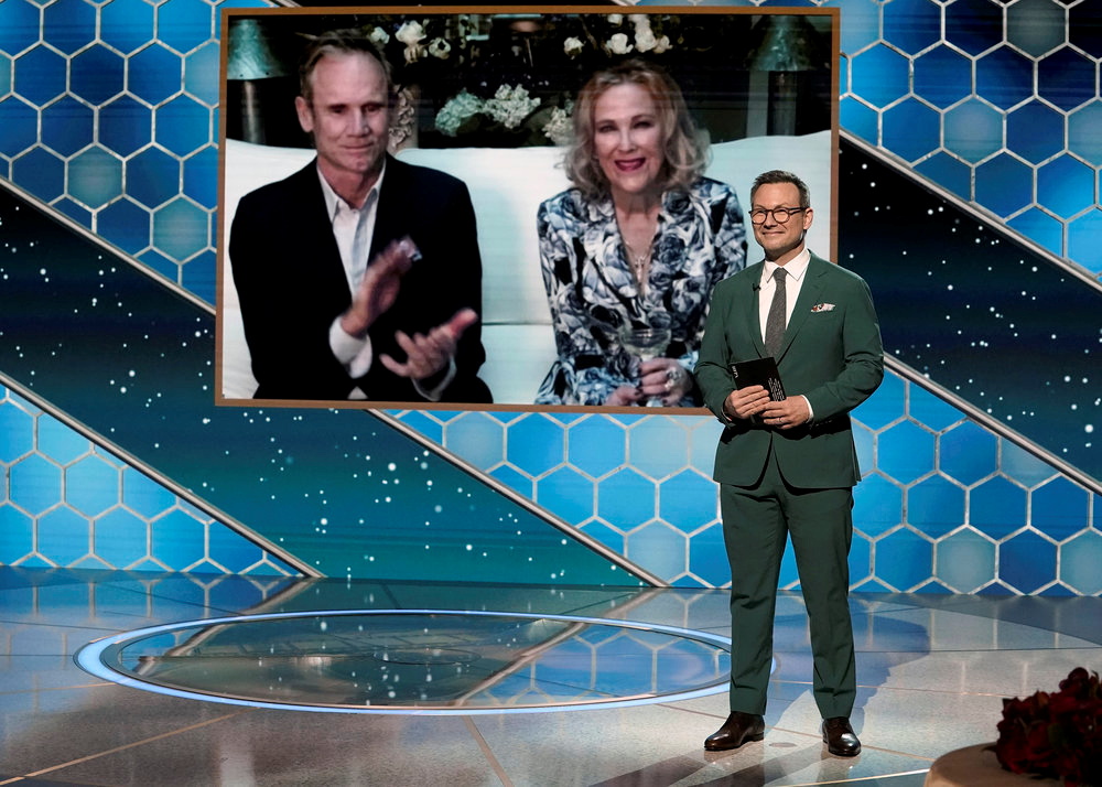 Actor Christian Slater presents the Best Actress - Television Series, Musical or Comedy award for "Schitt's Creek" to winner Catherine O'Hara, in this handout photo from the 78th Annual Golden Globe Awards in New York, New York State, U.S., February 28, 2021.