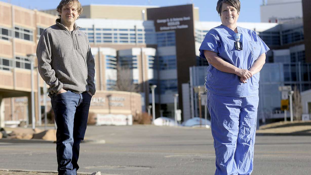 Registered nurses Sean Freeman, left, and Ronda Catmull pose for a portrait near University of Utah Hospital in Salt Lake City on Friday, Jan. 15, 2021. Catmull and Freeman used to work together in the cardiac catheterization lab at the hospital.