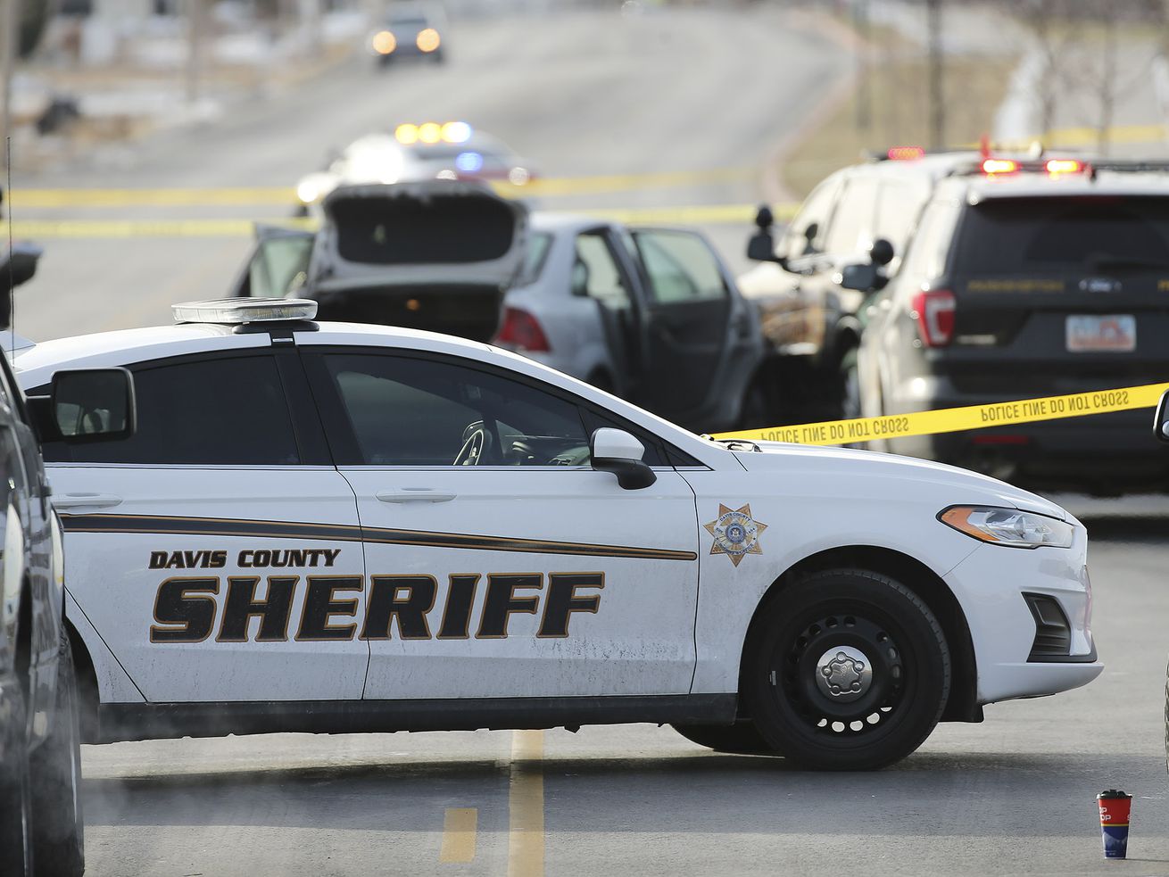 Members of the Davis County Sheriff’s Office and the
Farmington Police Department investigate an officer-involved fatal
shooting in Farmington on Sunday, Dec. 13, 2020.