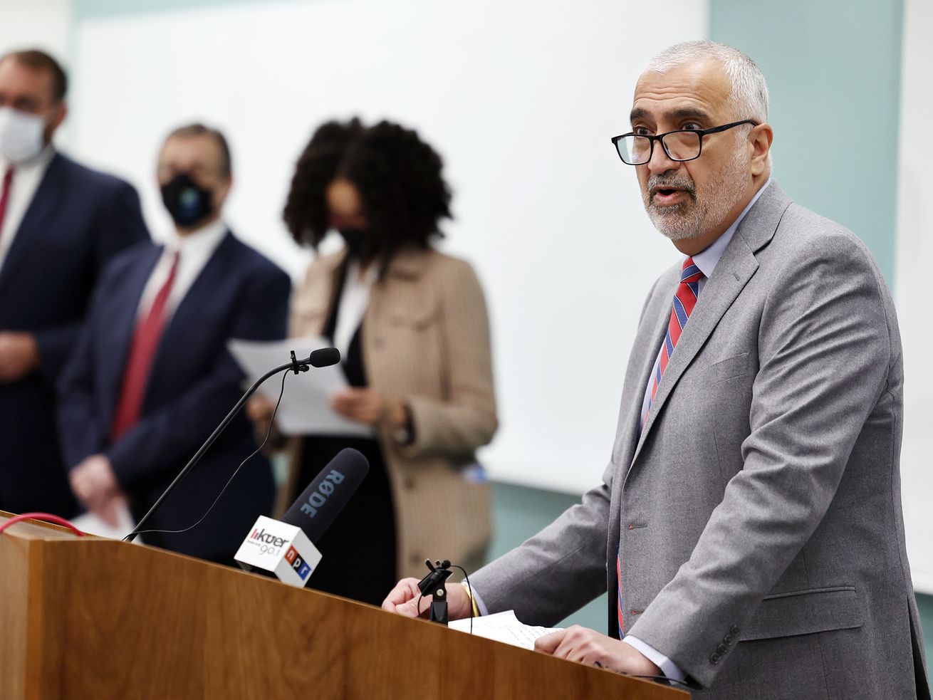 Salt Lake County District Attorney Sim Gill, right,
speaks to reporters as prosecutors and defense attorneys gather at
the Salt Lake County District Attorney’s Office building to
denounce what they say is a bad faith attempt to repeal bail reform
by some legislators in Salt Lake City on Monday, March 1, 2021.