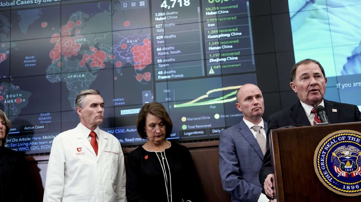 Gov. Gary Herbert, right, speaks during a press
conference in the Emergency Operations Center at the Capitol in
Salt Lake City on Thursday, March 12, 2020.