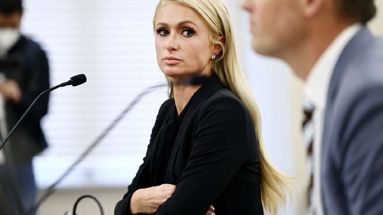 Paris Hilton looks over at Sen. Mike McKell, R-Spanish
Fork, as they testify about SB127 before the Senate Judiciary, Law
Enforcement and Criminal Justice Committee at the Capitol in Salt
Lake City on Monday, Feb. 8, 2021. The bill, sponsored by McKell,
would better regulate centers for troubled teens.