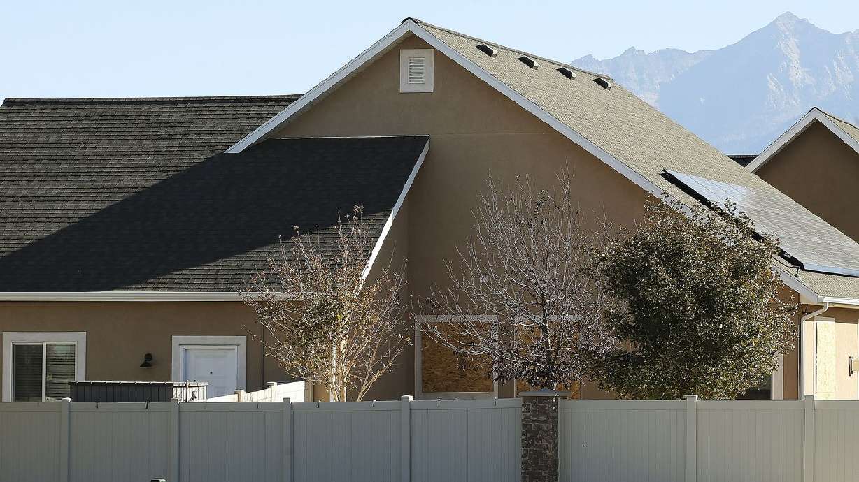 The windows of a house on 3371 W. Snow Moon Place
in South Jordan are boarded up on Nov. 1, 2020. The city has
filed a lawsuit saying the "literal minefield” of a house is
dangerous and needs to be razed. Even hammering a nail into a wall
in the wrong place could be deadly, the lawsuit says. Over the
summer, federal agents found approximately 20 pounds of highly
explosive materials and partially made bombs in the house.