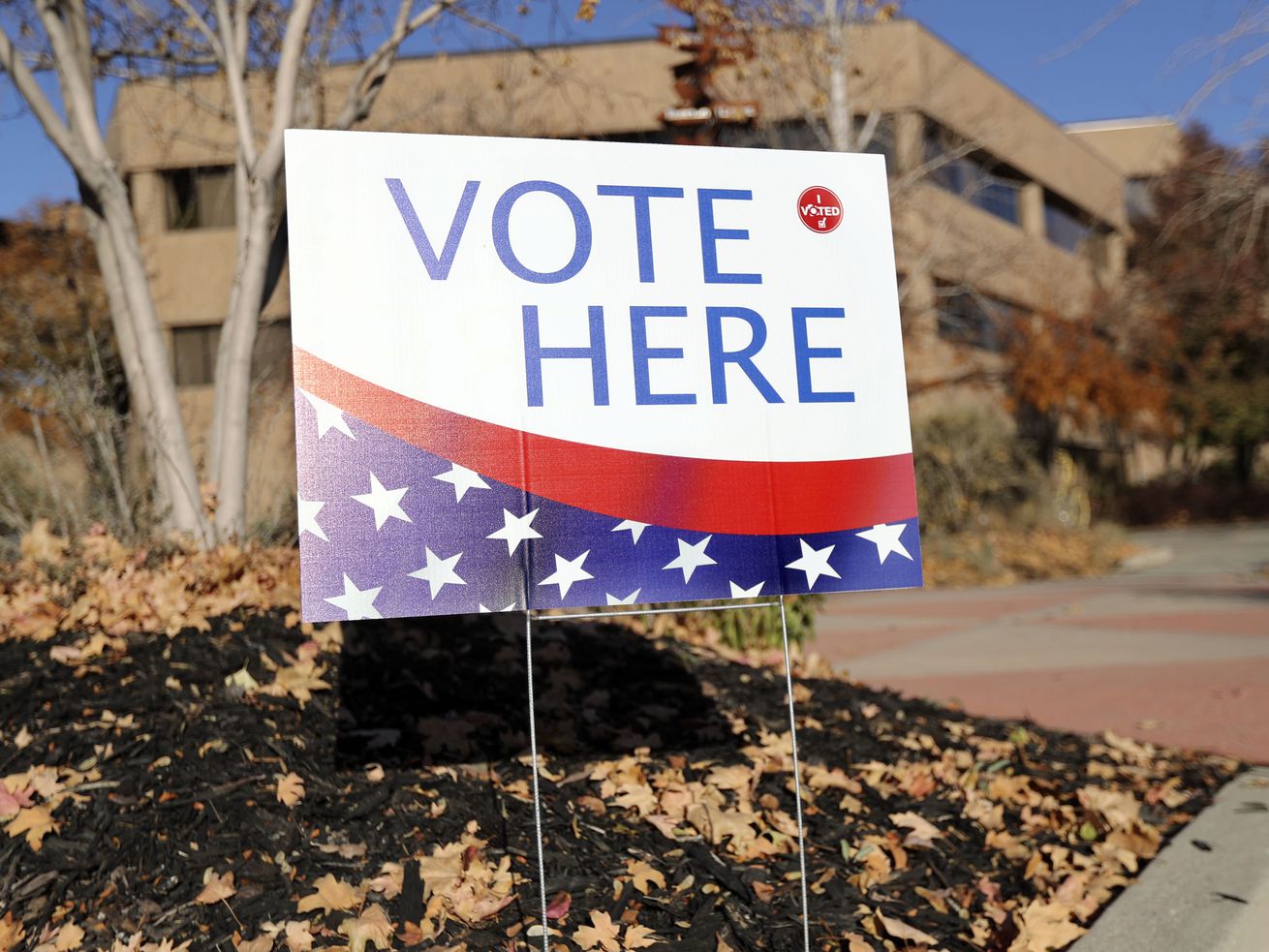 A "Vote Here” sign is pictured on Election Day at the
Salt Lake County Government Center in Salt Lake City. A bill to cut
off Utahns’ ability to switch political party affiliation months
before primary elections has won approval from the
Legislature. 