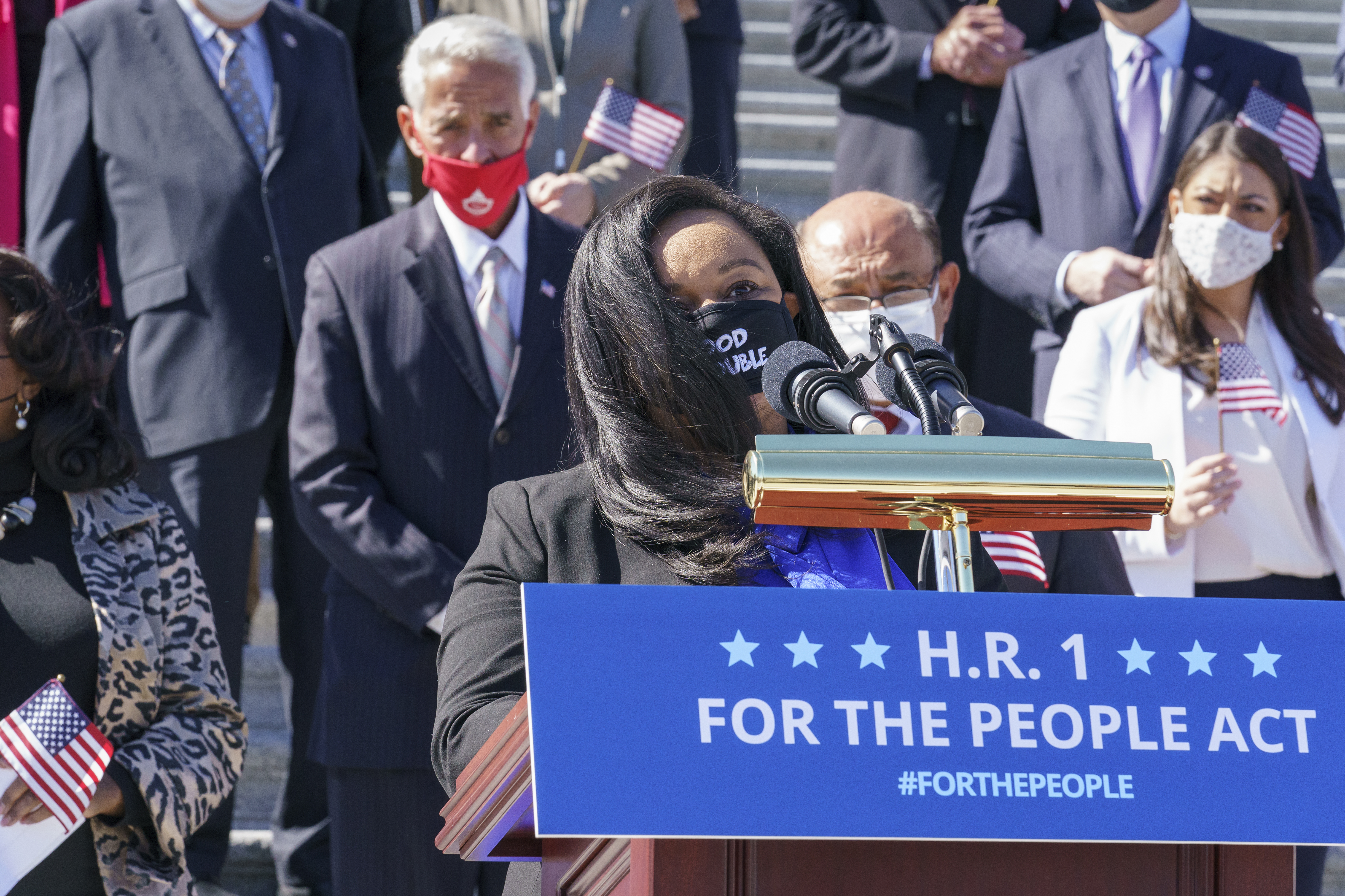 Rep. Nikema Williams, D-Ga, recalls the legacy of Rep. John Lewis as Democrats gather to address reporters on H.R. 1, the For the People Act of 2021, at the Capitol in Washington, Wednesday, March 3, 2021. House Democrats are poised to pass a sweeping elections and ethics bill, offering it up as a powerful counterweight to voting rights restrictions advancing in Republican-controlled statehouses.