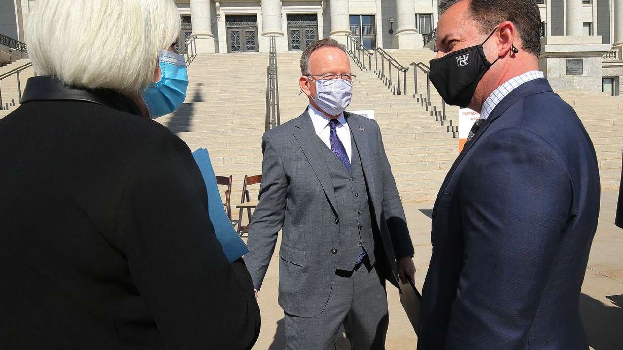 Gail Miller, left, talks with Senate President Stuart
Adams, R-Layton, center, and House Speaker Brad Wilson,
R-Kaysville, outside of the Capitol in Salt Lake City on Wednesday,
March 3, 2021, prior to a press conference on a public-private
partnership to help address homelessness and affordable housing.