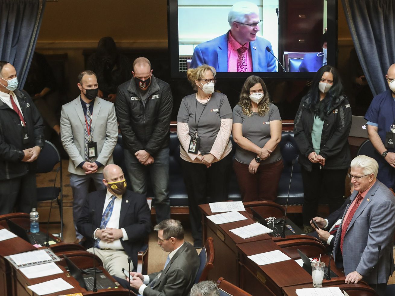 Members of the Utah Department of Health’s mobile
testing team stand as they are recognized by members of the Senate
at the Capitol in Salt Lake City on Thursday, March 4, 2021. Team
members were honored for their work administering COVID-19 tests to
legislators and staff throughout the 2021 general session.
