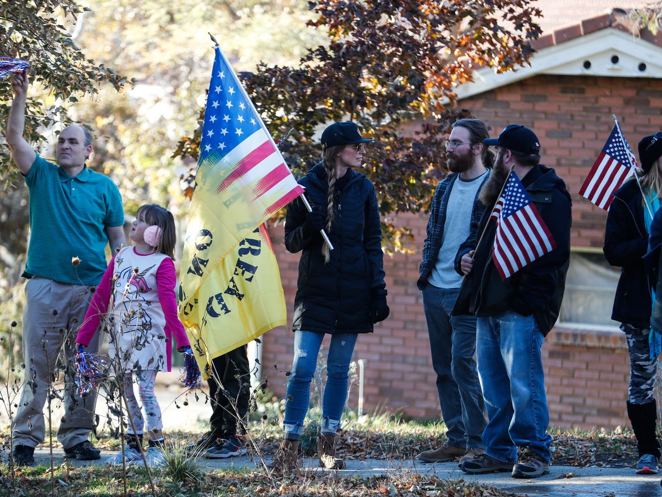 Protesters stands on the sidewalk across the street
from state epidemiologist Dr. Angela Dunn’s house in Salt Lake City
on Thursday, Oct. 29, 2020. The Utah Legislature passed a bill on
Thursday to prohibit targeted residential picketing close to
someone’s home.