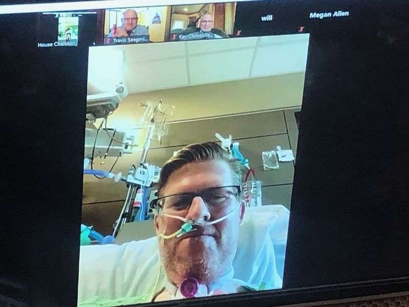 Rep. Jon Hawkins, R-Pleasant Grove, greets members of
the House on Thursday, March 4, 2021, from his intensive care unit
hospital bed via a Zoom call. Hawkins has been battling
COVID-19.