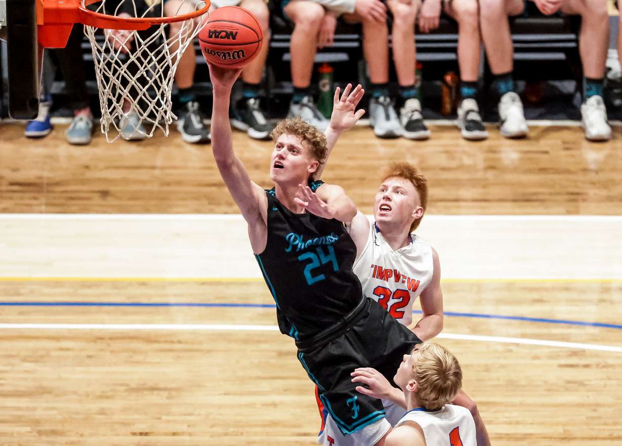 Farmington’s Collin Chandler goes to the hoop in a 5A boys basketball semifinal game against Timpview at Salt Lake Community College in Taylorsville, March 5, 2021.