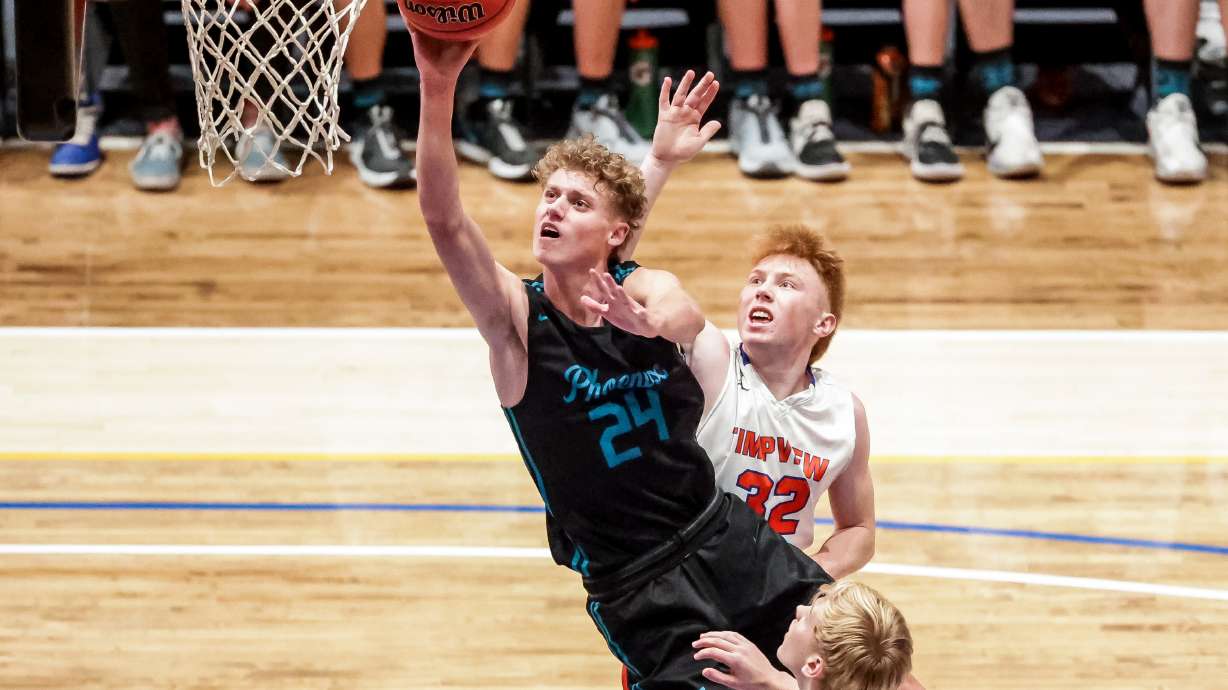 Farmington’s Collin Chandler goes to the hoop in a 5A boys basketball semifinal game against Timpview at Salt Lake Community College in Taylorsville on Friday, March 5, 2021.