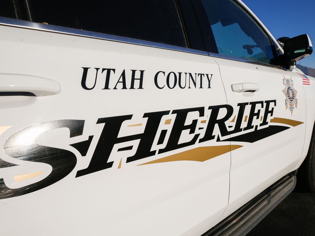 A Santaquin fugitive with a history of drug-related arrests was taken into custody Wednesday after deputies say he rammed two police cars in an effort to escape.