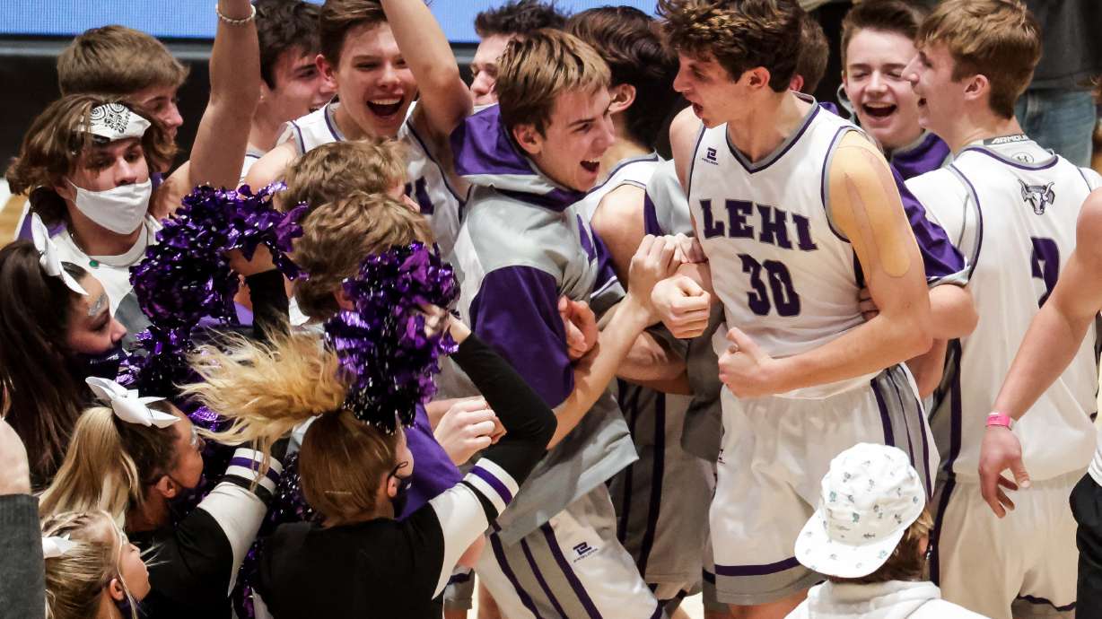 Lehi celebrates after beating Farmington in the 5A boys basketball championship at Salt Lake Community College in Taylorsville on Saturday, March 6, 2021.