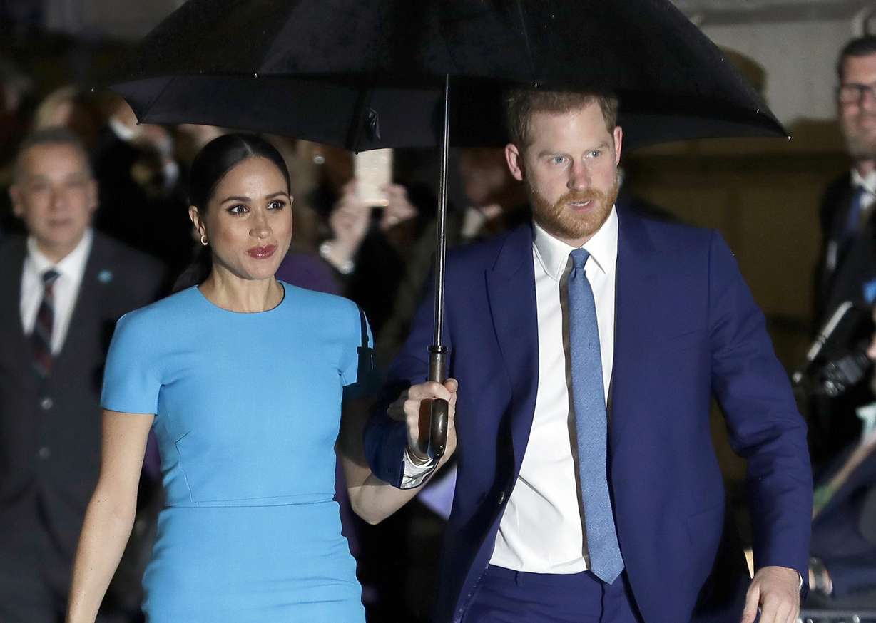 FILE - In this March 5, 2020, file photo, Britain's Prince Harry and Meghan, Duchess of Sussex, arrive at the annual Endeavour Fund Awards in London. In an interview with Oprah Winfrey, Prince Harry says the process of separating from royal life has been very difficult for him and his wife, Meghan. The interview special is scheduled to air March 7, 2021, on CBS and the following day in Britain.