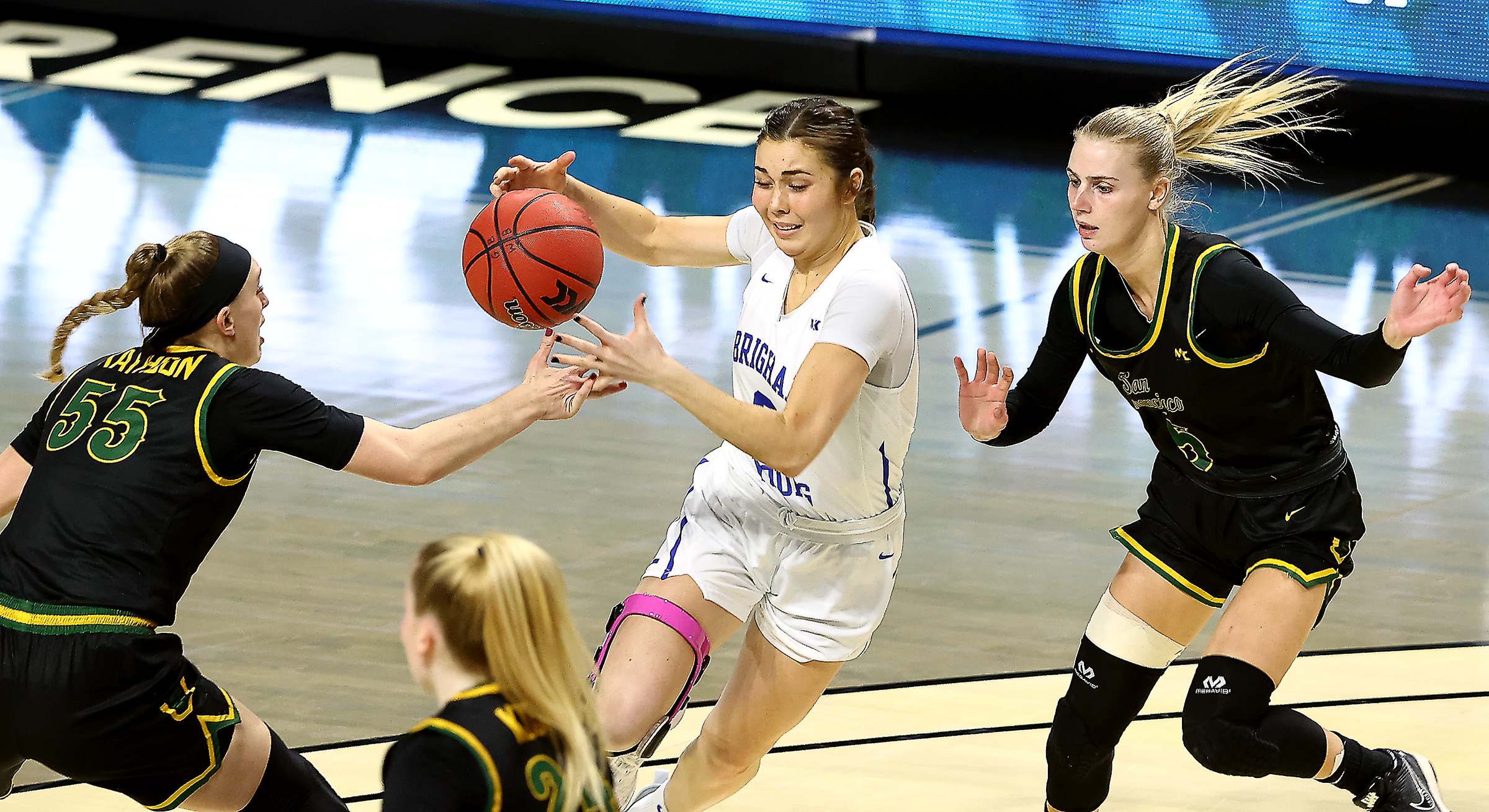 BYU Cougars guard Shaylee Gonzales (2) drives between San Francisco Dons guard Abby Rathbun (55) and San Francisco Dons guard Amalie Langer (5) on her way into the paint as BYU and San Francisco play in semifinal West Coast Conference tournament basketball action at the Orleans Arena in Las Vegas on Monday, March 8, 2021. BYU won 85-55.