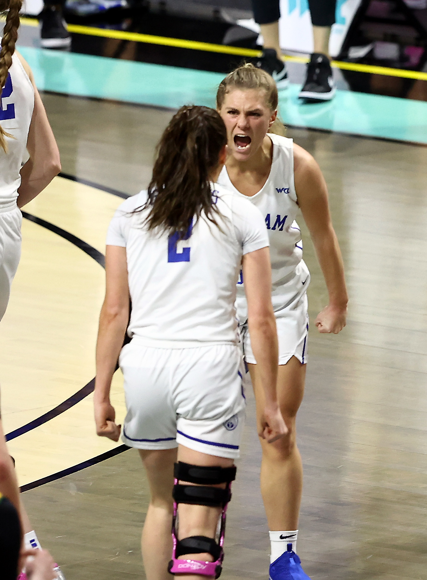 BYU guard Paisley Johnson Harding and Shaylee Gonzales celebrate a big play as BYU and San Francisco play in semifinal West Coast Conference tournament basketball action at the Orleans Arena in Las Vegas on Monday, March 8, 2021.