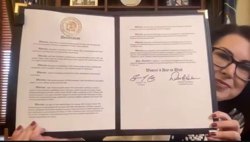 In this Monday, March 8, 2021, screenshot, Utah Lt. Gov. Diedre Henderson shows her signed declaration commemorating International Women’s Day.