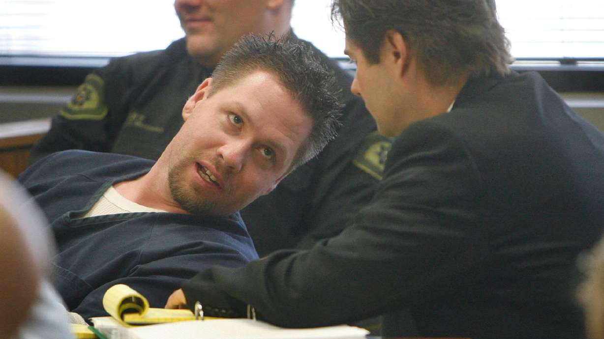 Timmy Brent Olsen, left, leans over and talks with his
defense attorney, Dana Facemyer, after Facemyer just finished a
cross-examination of a witness during the third day of a
preliminary hearing for Olsen and Christopher Jeppson at the 4th
District Court in Provo, Jan. 10, 2008. On Tuesday, March 9, 2020,
Olsen, now 43, had his first parole hearing following his
conviction for his role in high profile disappearance and death of
15-year-old Kiplyn Davis, of Spanish Fork.