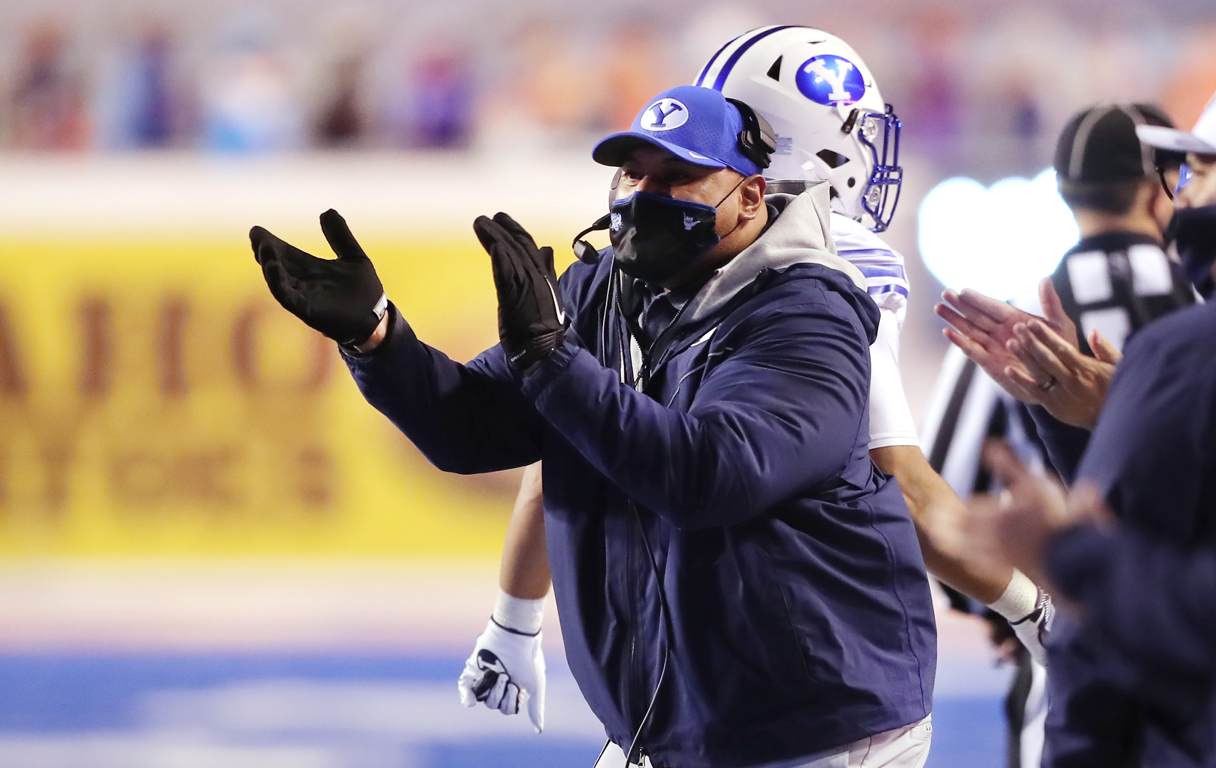 BYU coach Kalani Sitake cheers on his team as the Cougars and Boise State play at Albertsons Stadium in Boise on Friday, Nov. 6, 2020. BYU won 51-17.