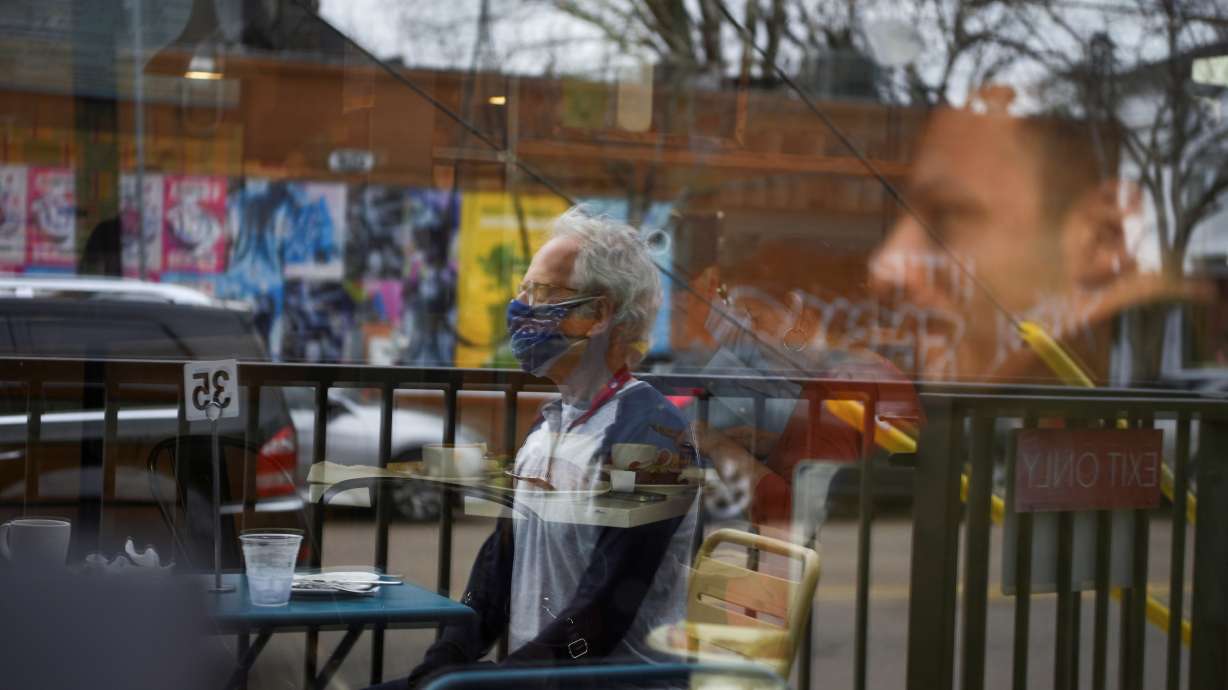 Herb Pasternak wears a mask while dining outdoors as the state of Texas lifts its mask mandate and allows businesses to reopen at full capacity during the coronavirus disease (COVID-19) pandemic in Houston, Texas, U.S., March 10, 2021. REUTERS/Callaghan O'Hare