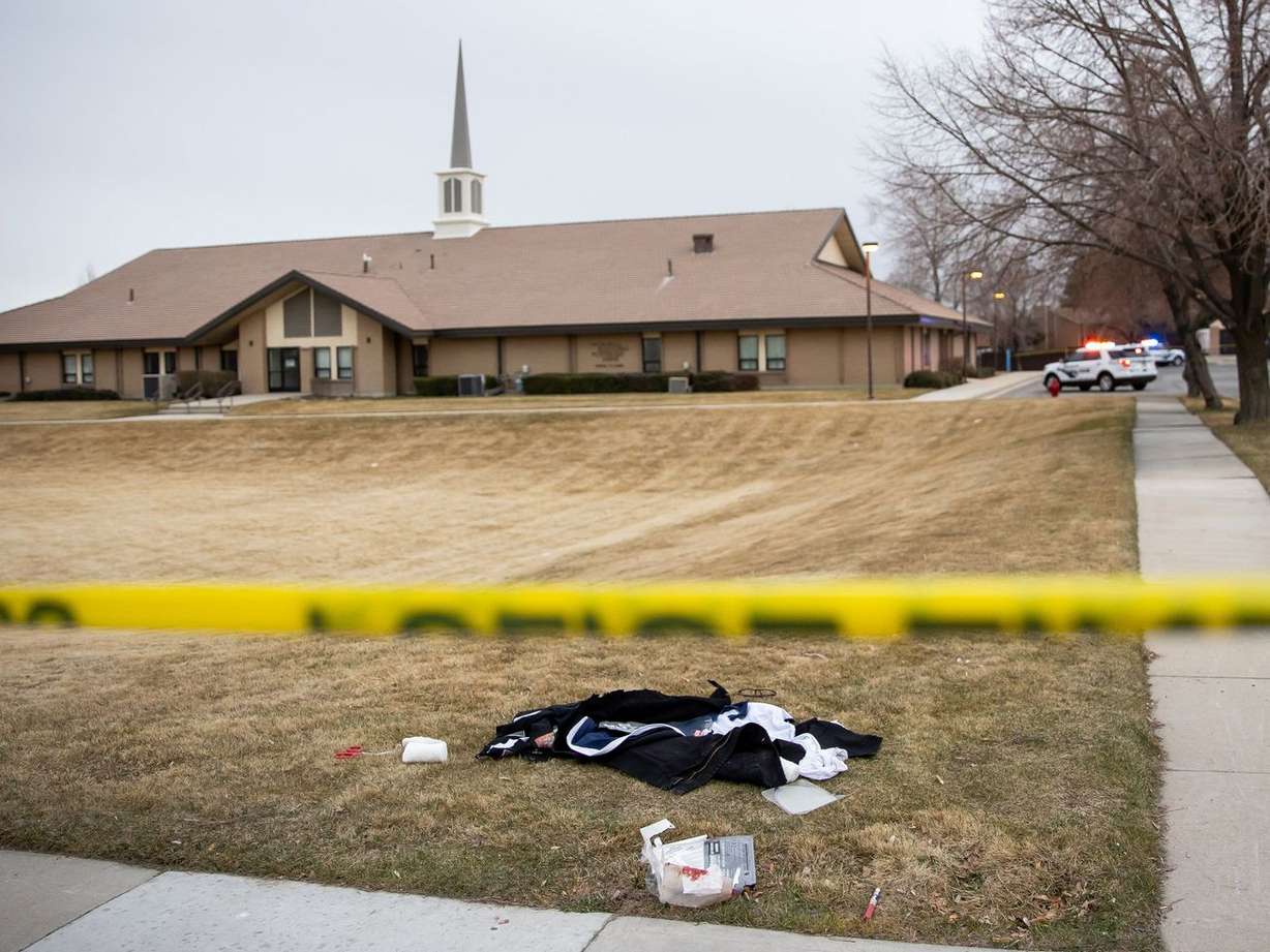 Clothing and medical supplies are seen on the ground as police investigate a shooting in a church parking lot in the area of 5300 West and 5400 South in Kearns on March 9, 2021.
