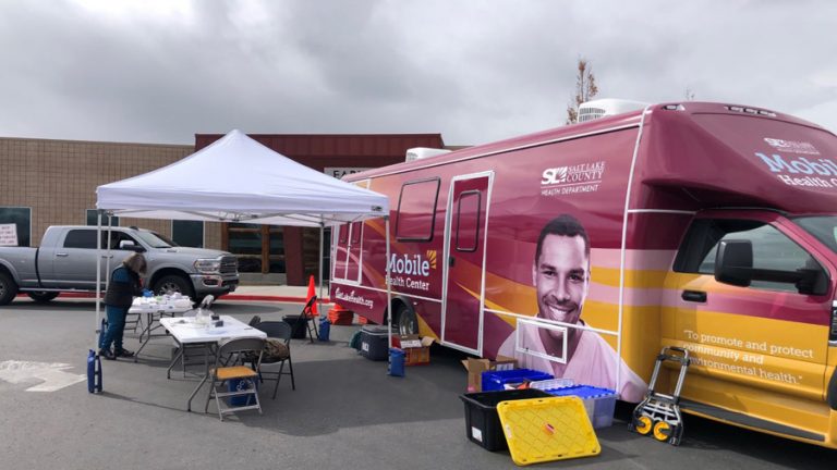A Salt Lake County Health Department van is set up on the city's west side to give vaccine shots Wednesday, March 10, 2021.