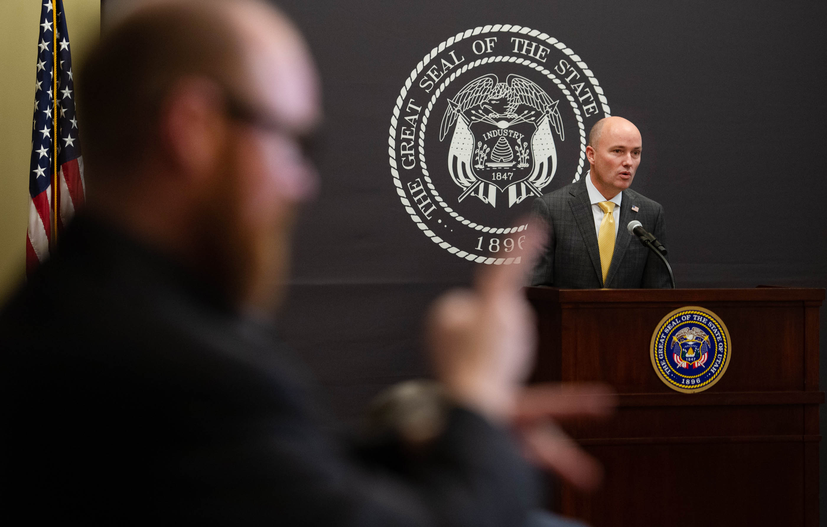 Clay Anderson, left, interprets for the hearing impaired as Gov. Spencer Cox provides updates on the ongoing pandemic during a news conference at the Capitol in Salt Lake City on Thursday, March 11, 2021.