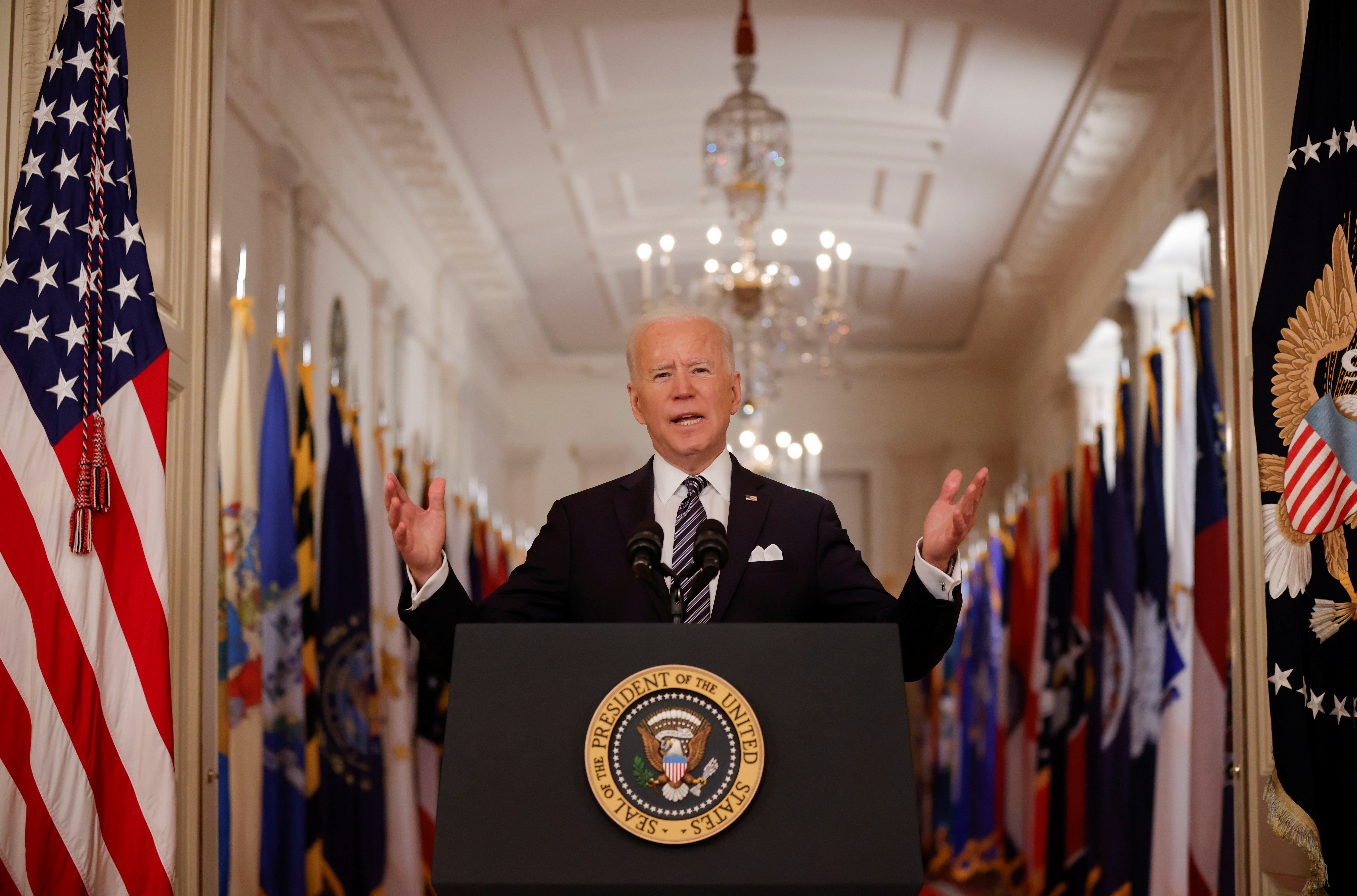 U.S. President Joe Biden delivers his first prime time address as president, marking the one-year anniversary of widespread shutdowns to combat the coronavirus disease (COVID-19) pandemic and speaking about the impact of the pandemic during an address from the East Room of the White House in Washington, U.S., March 11, 2021. REUTERS/Tom Brenner